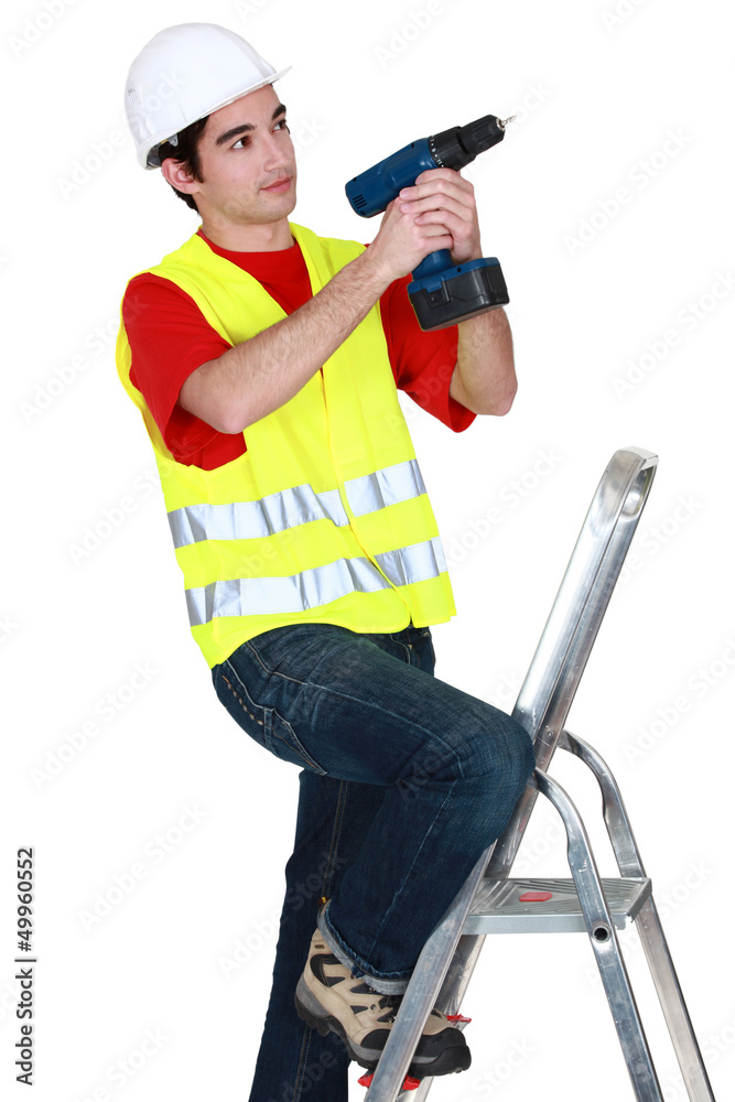 Man with a cordless drill