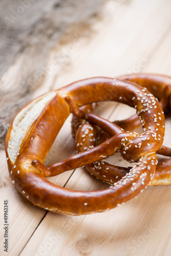 Freshly baked pretzels on wooden boards, studio shot