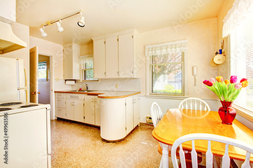 White old small kitchen in American house build in 1942.