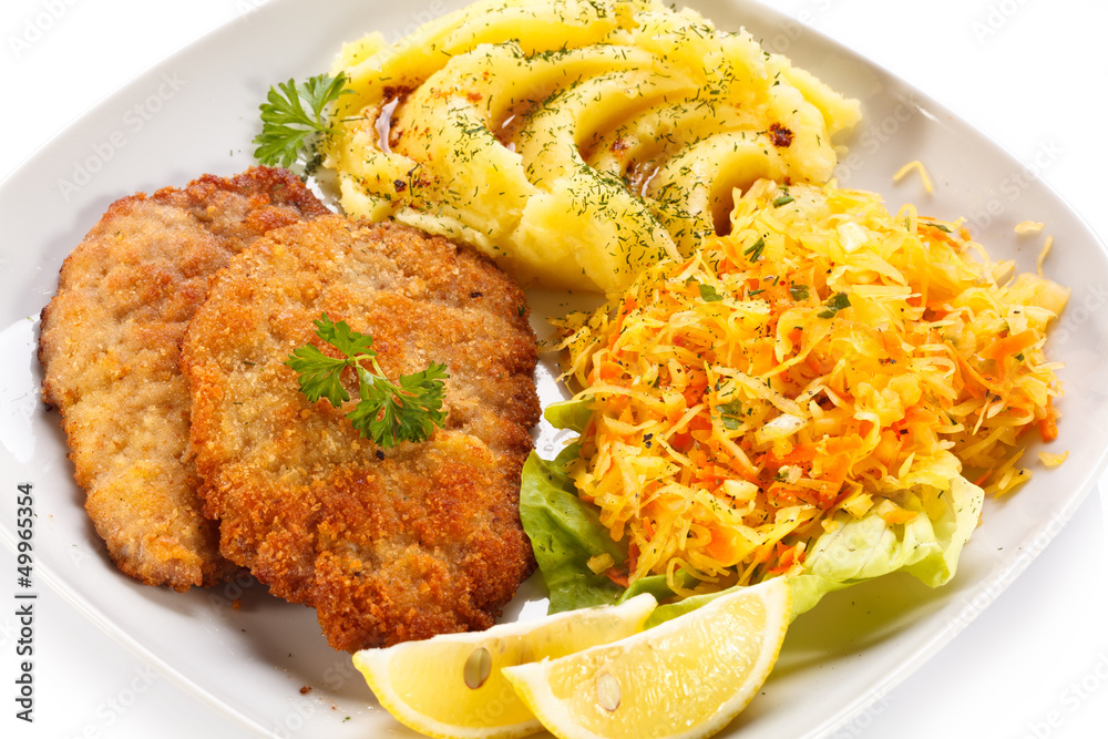 Fototapeta premium Pork chops, mashed potatoes and vegetable salad