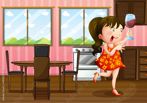 A girl holding a glass of wine in the kitchen