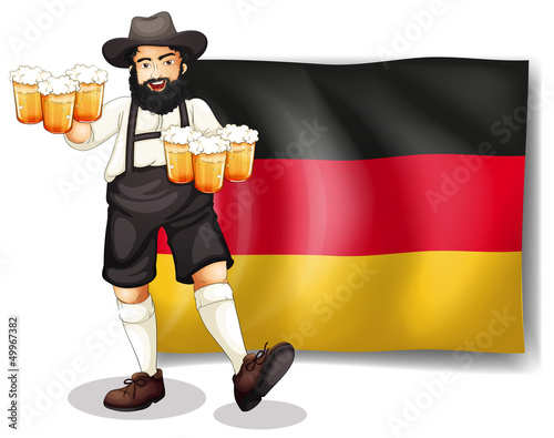 A man holding a beer in front of a flag