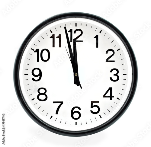 Black wall clock, two minutes to twelve