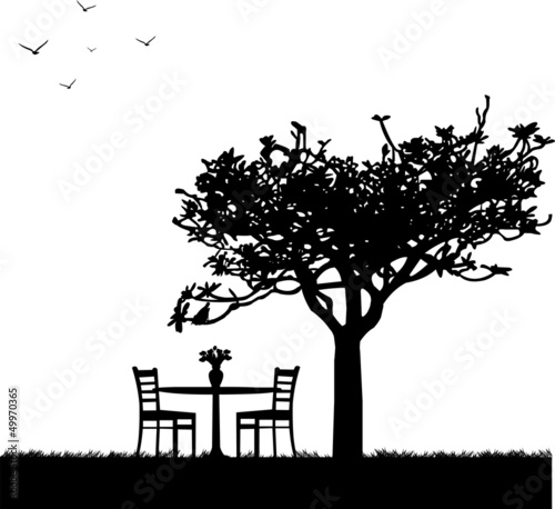 Fototapeta Naklejka Na Ścianę i Meble -  Park in spring with table for two and tulips in a vase