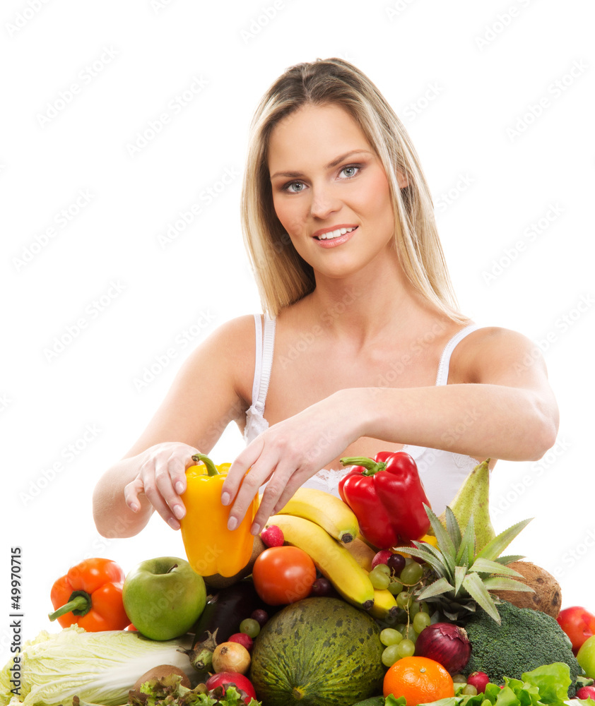 A young blond woman and fresh and healthy vegetables A young blond woman and fresh and healthy vegetables