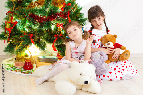 girls at a New Year tree