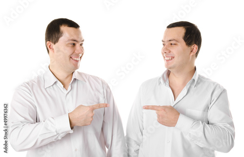 Two attractive positive smiling young men twins isolated