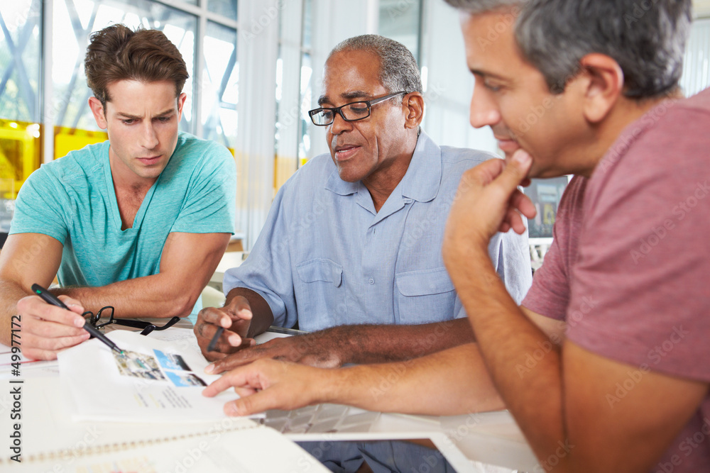 Fototapeta premium Group Of Men Meeting In Creative Office