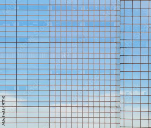 modern facade of glass  with reflections of building