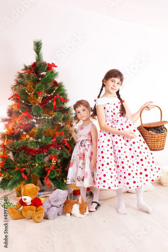 girls at a New Year tree