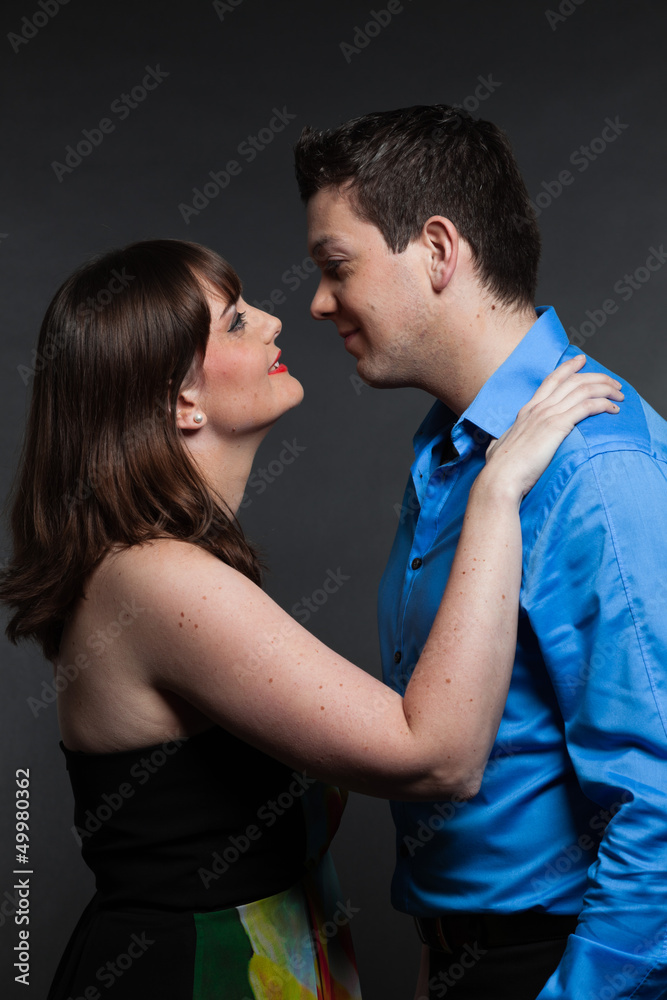 Romantic young couple in love. Man and woman. Studio shot. Romantic young couple in love. Man and woman. Studio shot.