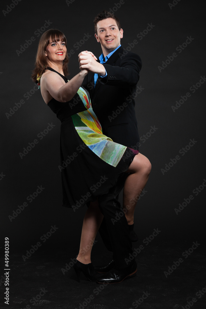 Romantic happy young couple dancing together. Stylish dressed. Romantic happy young couple dancing together. Stylish dressed.