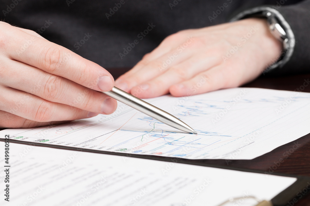Business men reading contract Business men reading contract