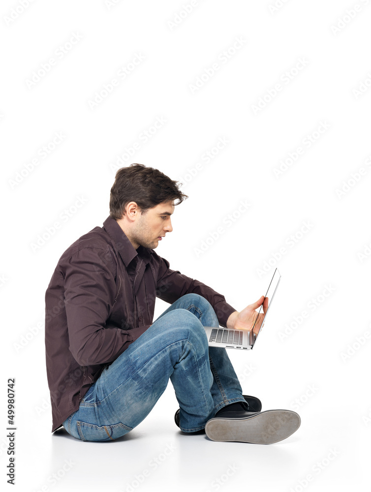 Portrait of  happy man working on laptop
