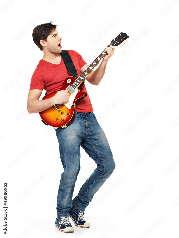 Young guitarist plays on the electric guitar Young guitarist plays on the electric guitar