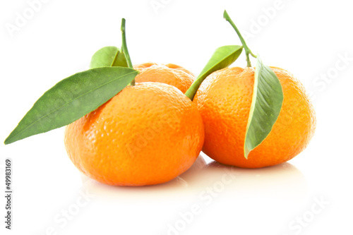 Group of tangerine with leaves on the white background