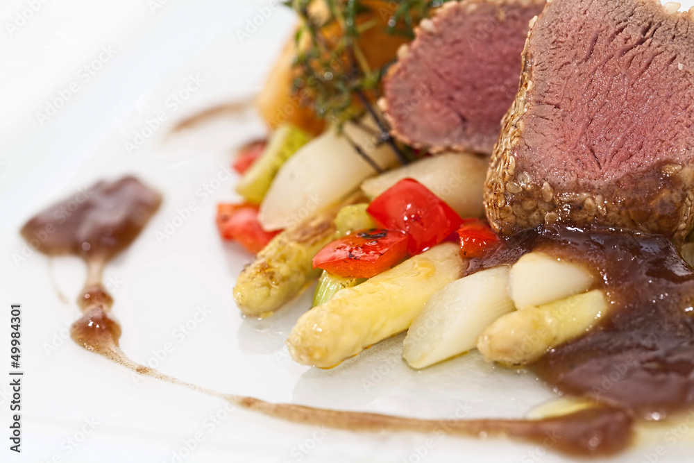 Roasted saddle of lamb on asparagus ragout and herbs Roasted saddle of lamb on asparagus ragout and herbs