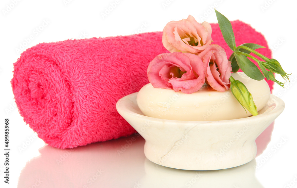 Rolled pink towel, soap bar and beautiful flower isolated Rolled pink towel, soap bar and beautiful flower isolated