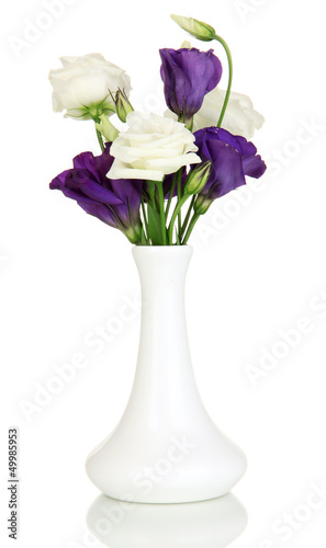 Bouquet of eustoma flowers in vase isolated on white