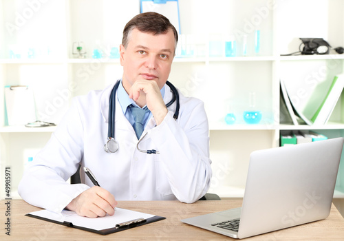 Medical doctor working at desk