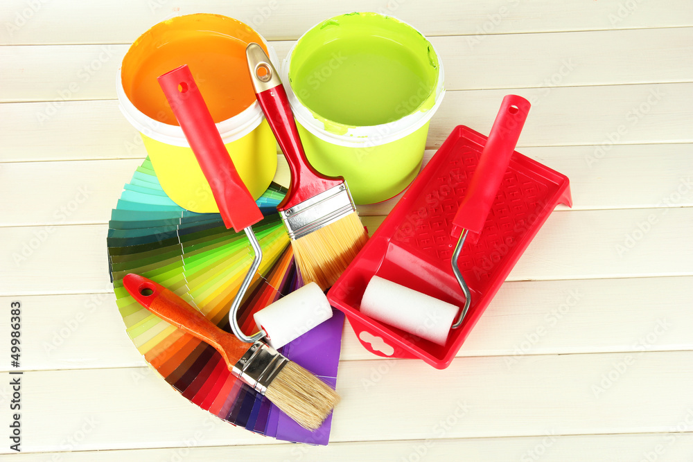 Set for painting: paint pots, brushes, paint-roller Set for painting: paint pots, brushes, paint-roller