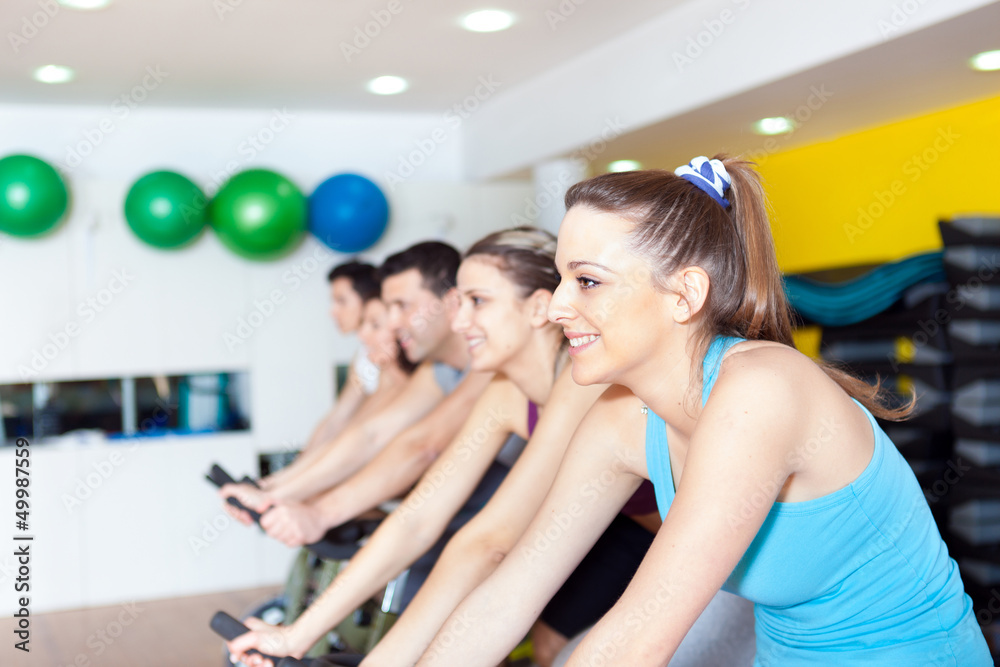 Group of people in the gym doing cardio training Group of people in the gym doing cardio training