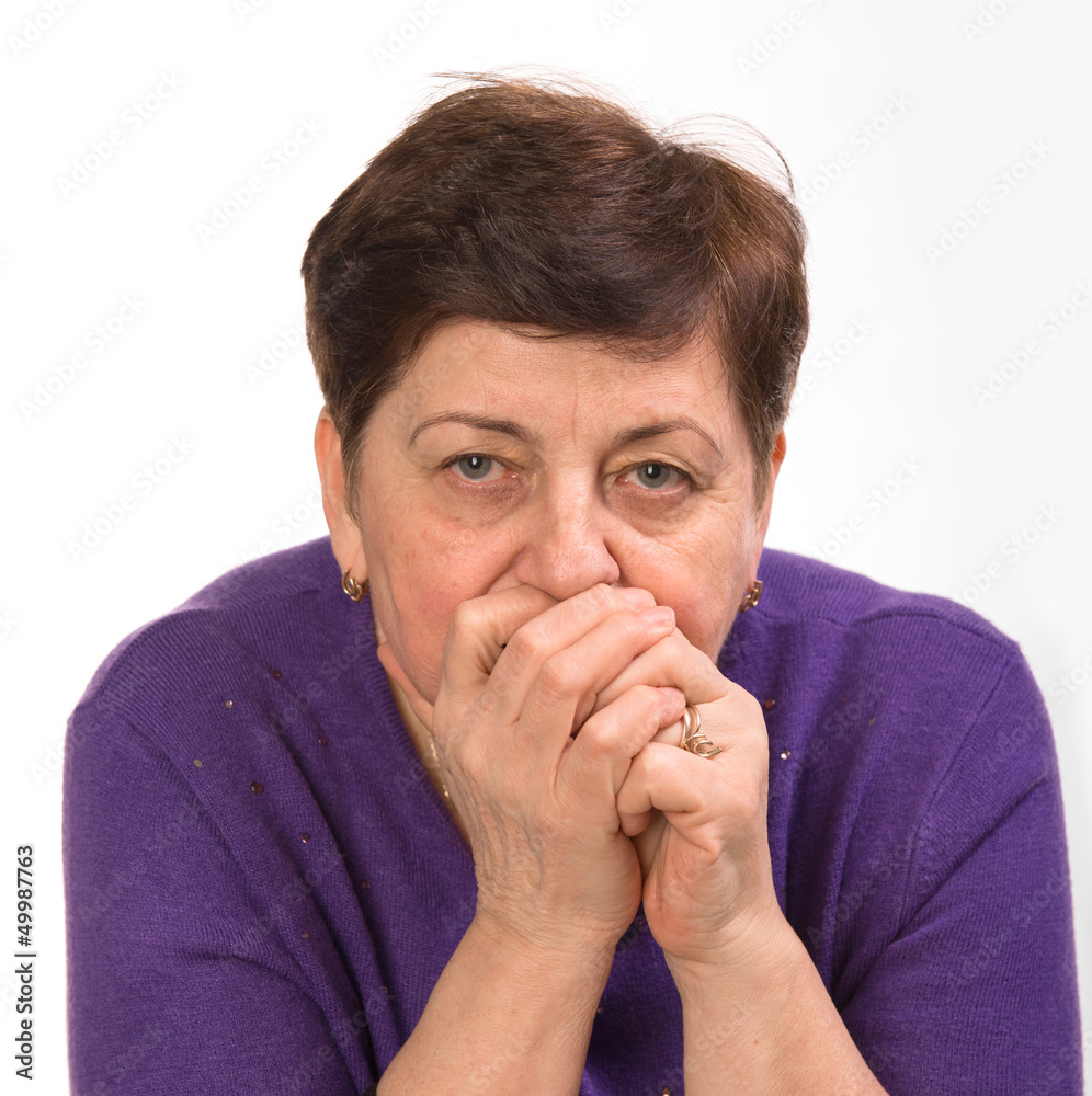 Close-up portrait of mature woman with hands on a mouth Close-up portrait of mature woman with hands on a mouth