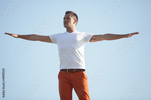 Stock image of a man with arms outstretched