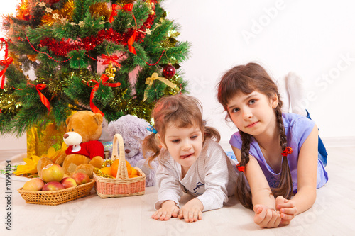 girls at a New Year tree