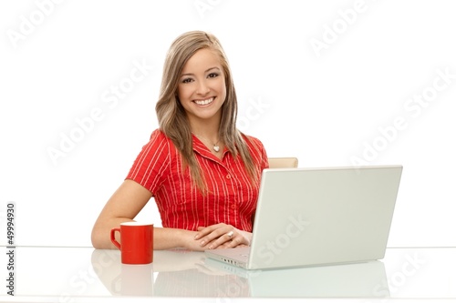 Portrait of happy woman with laptop