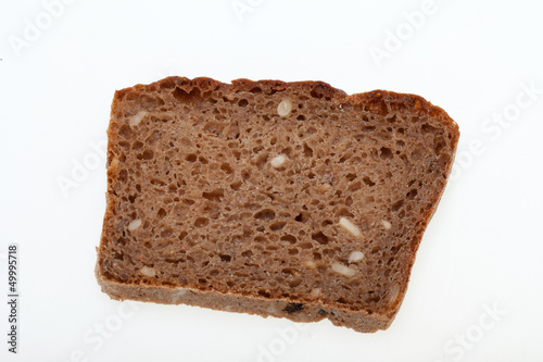 Slice of dark bread isolated over white