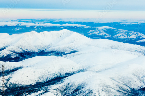 Aerial view of snowy winter mountains Yukon Canada