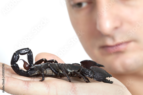 Young Caucasian man with scorpion