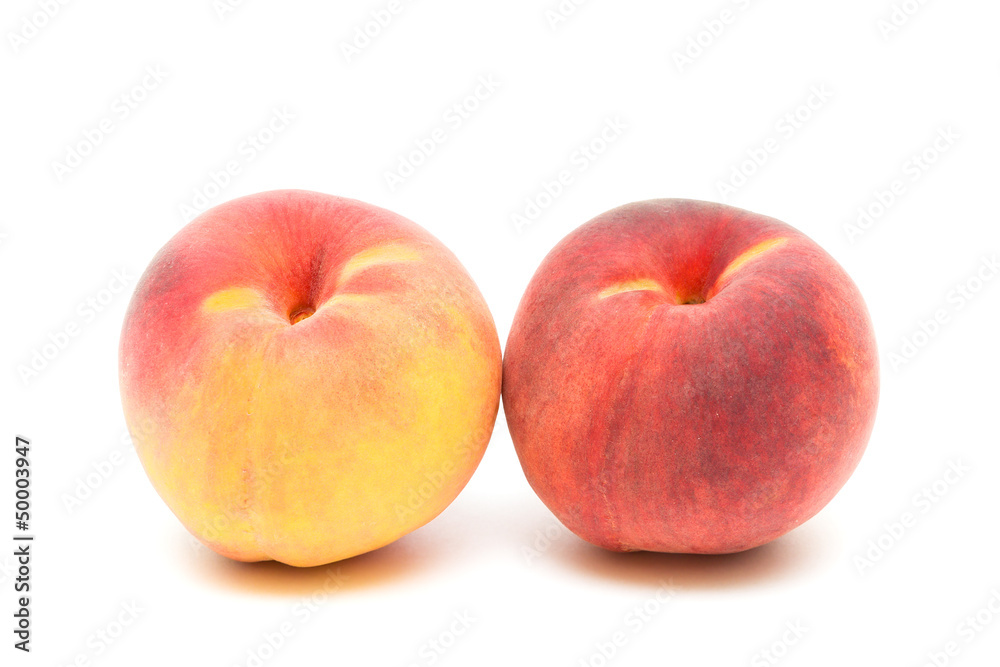 two peaches on a white background close-up two peaches on a white background close-up