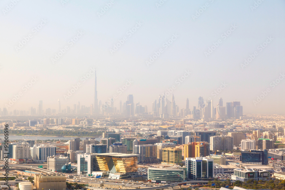 Dubai's skyscrapers and top view on a sunny day