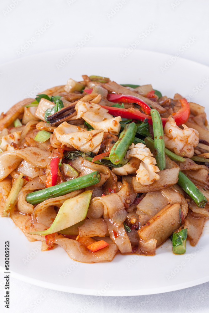 Flat rice noodle stir fried withseafood.