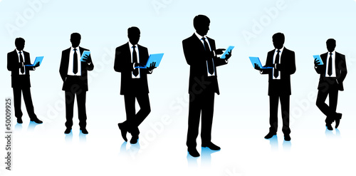 Silhouettes of businessmen with computers