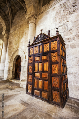 Ancient wooden confessional photo