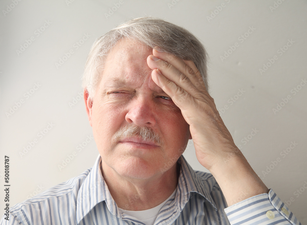 senior man has a bad headache senior man has a bad headache