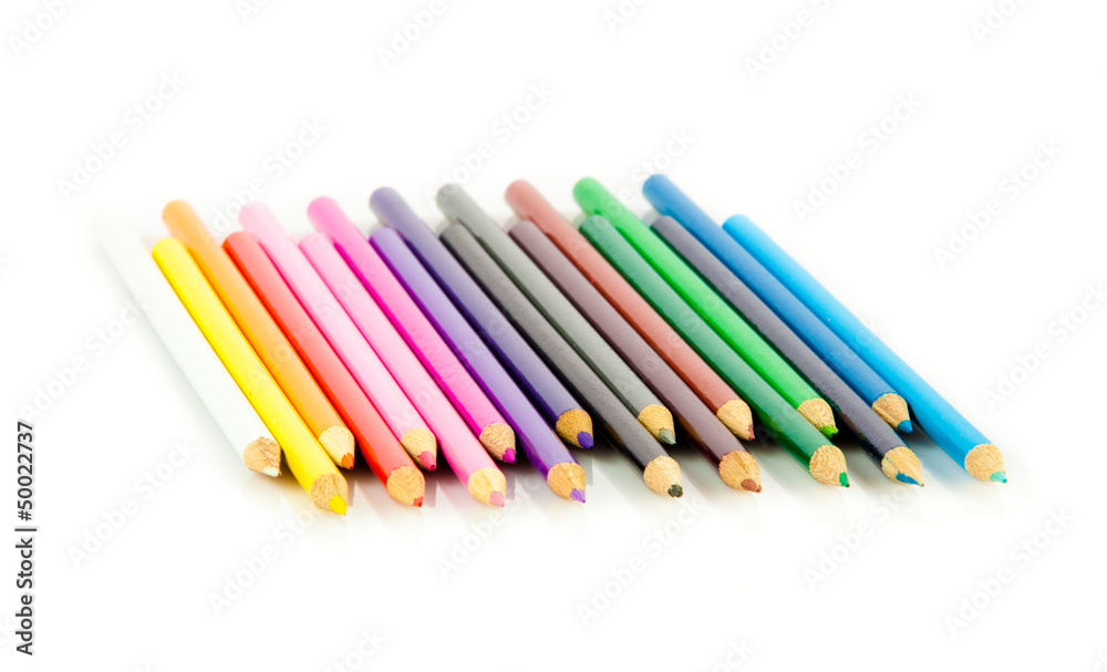 Colour pencils isolated on white background. Many different col Colour pencils isolated on white background. Many different col