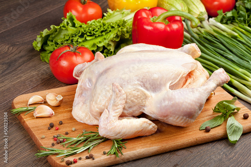 Fresh raw chicken and vegetables