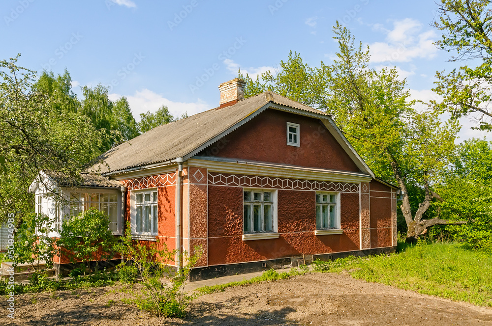 A typical red Ukrainian house, in the countryside near Kiev	