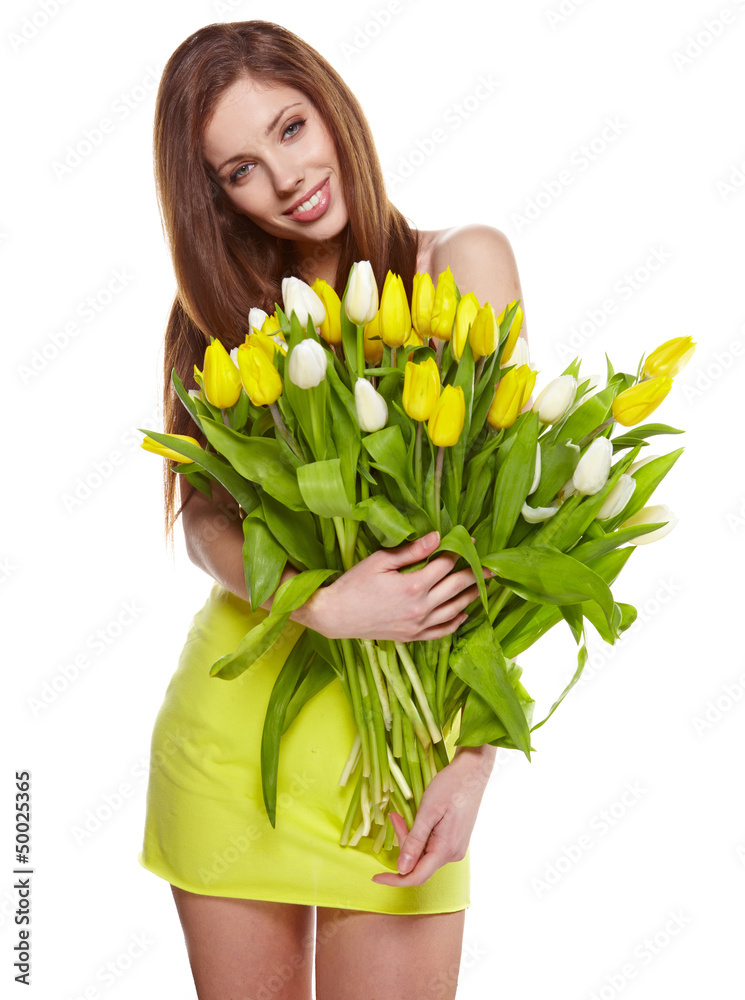 Pretty woman holding a bouquet of tulips
