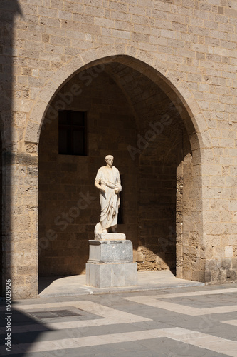 Old statue in castle of Rhodes  Greece