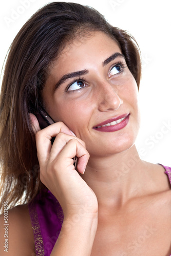 Young attractive woman on the cell phone, listening.