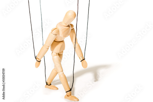 Concept of controlled marionette photo
