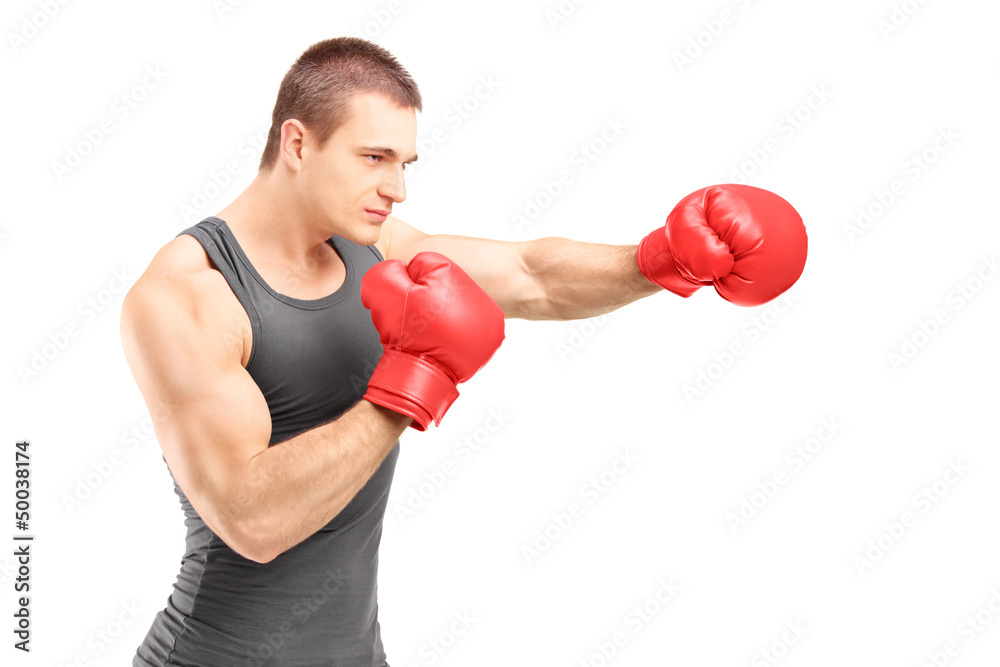 Male boxer punching with red boxing gloves Male boxer punching with red boxing gloves