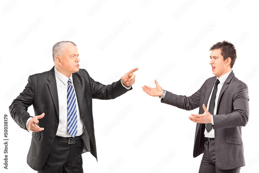Mature man in a suit having a dispute with a young man in formal