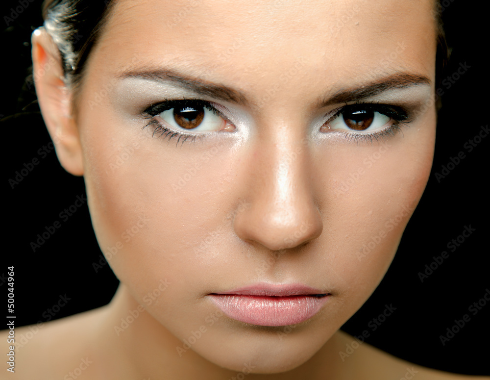 A portrait of a beautiful woman isolated on black background A portrait of a beautiful woman isolated on black background
