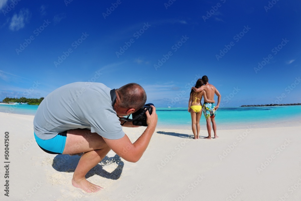 Fototapeta premium photographer taking photo on beach